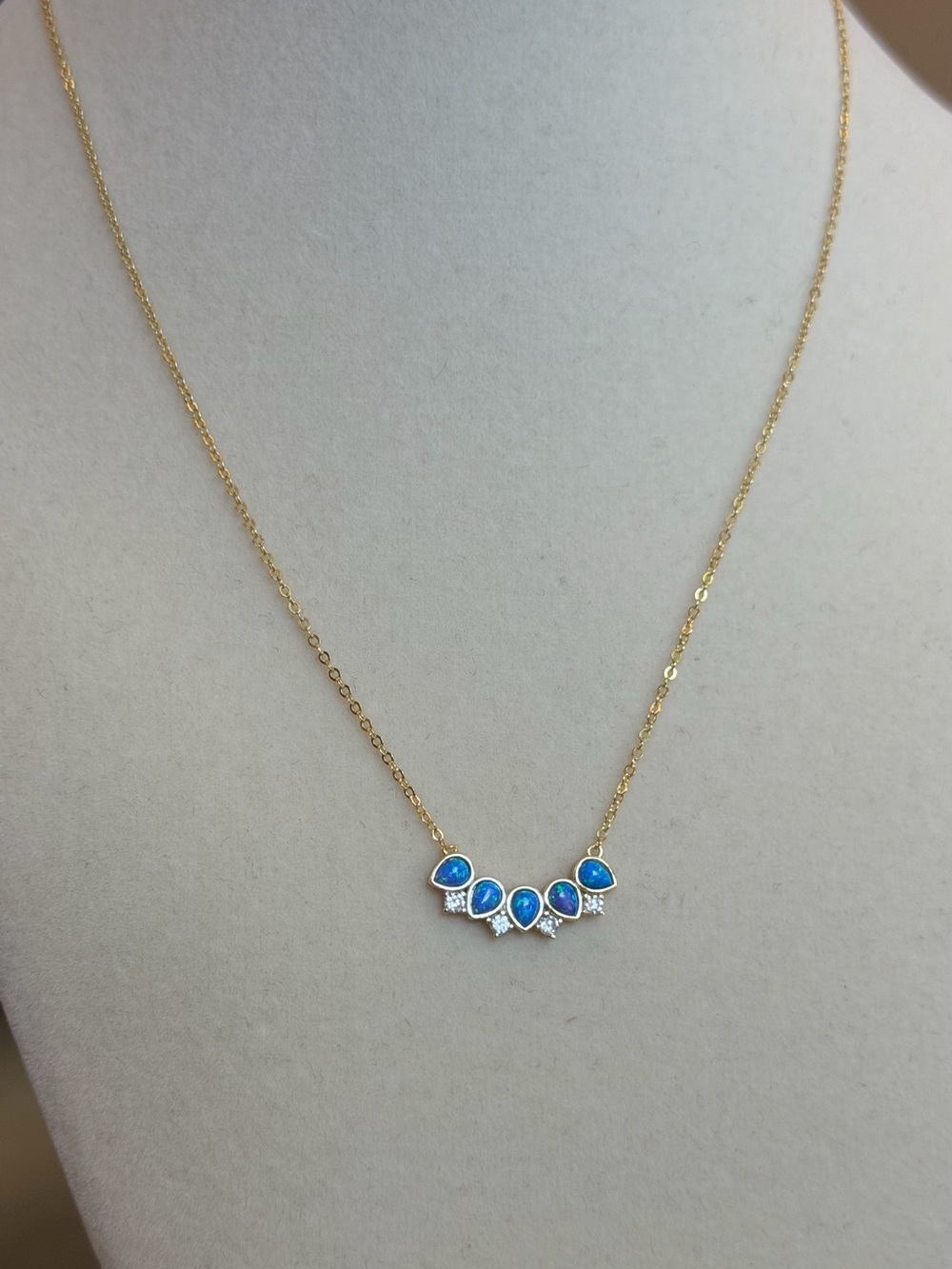 Gold Necklace with Blue Opal Teardrop Accents